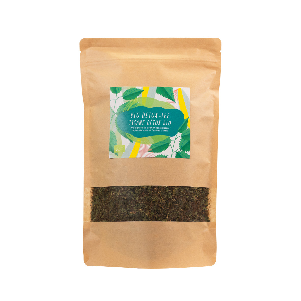Standbeutel mit Bio Detox-Tee, gefüllt mit einer Kräutermischung aus Maisgriffel und Brennnesselblättern. Etikett in Grün mit bunten Blattelementen und zweisprachiger Beschriftung.